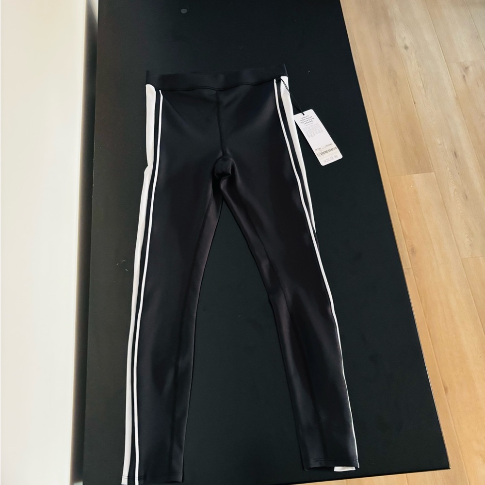 ALO Yoga Sporty Black and White Leggings with Striking Stripes